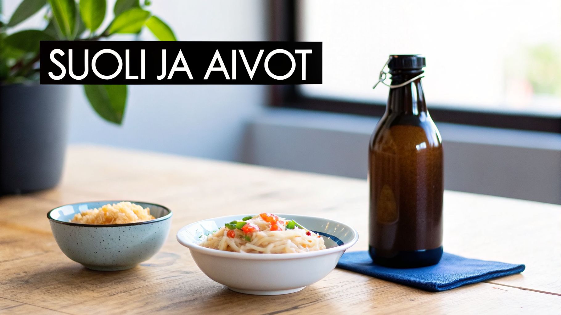 Kuva ruokapöydästä, jossa on kaksi kulhoa ruokaa, ruskea pullo ja teksti 'SUOLI JA AIVOT'.